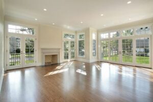 Open living room with replacement windows and new sliding glass door